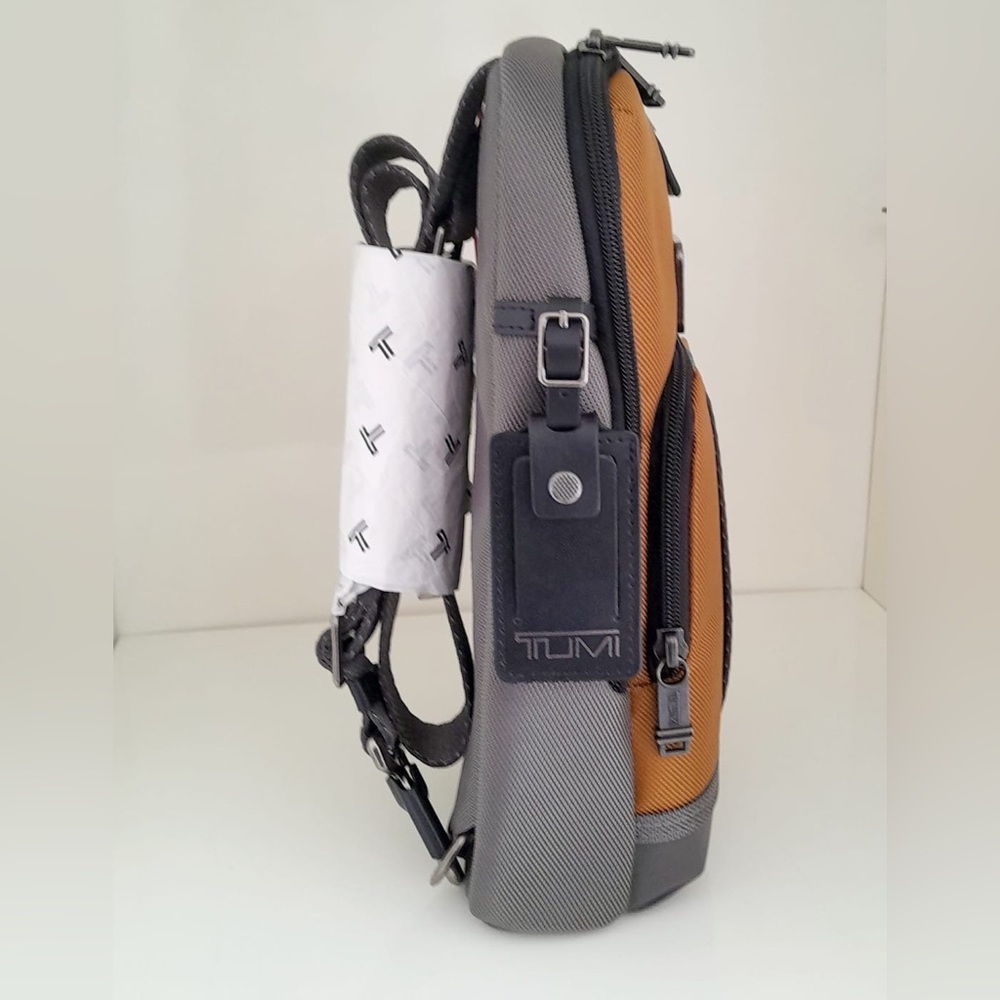 NWT Tumi FIFE Slim Sling Bag Golden Brown and Gray - Picture 3 of 4